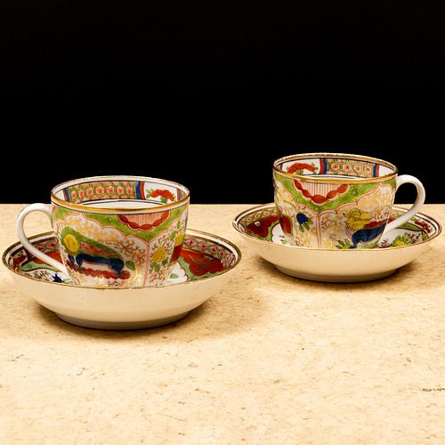 Pair of Worcester Porcelain 'Dragon in Compartments' Tea Cups and Saucers