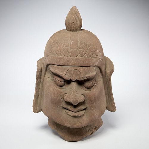 Early Asian carved stone Guardian head fragment