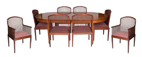 A MID-CENTURY MODERN WOOD DINING TABLE ACCOMPANIED WITH EIGHT CHAIRS