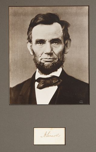 A CUT SIGNATURE AND PHOTOGRAPH [ABRAHAM LINCOLN] FORMER PRESIDENT 