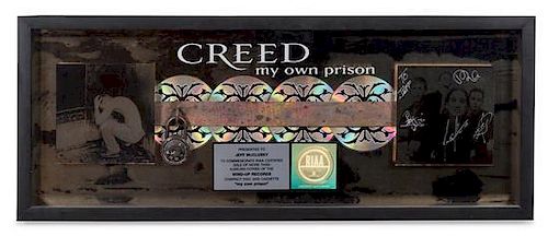 An Autographed Creed: My Own Prison RIAA Certified 4x Platinum Presentation Album 12 x 31 inches.