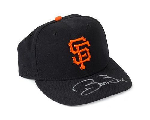 A Barry Bonds Autographed Baseball Hat Height of display case 6 1/2 inches x width 10 1/2 x depth 9 1/2 inches.