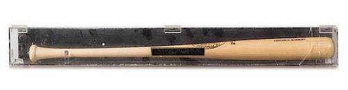 A Yogi Berra Autographed Baseball Bat Length of display case 63 3/4 inches.