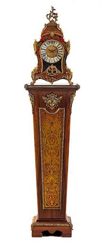 * A Napoleon III Style Simulated Boulle Marquetry Clock and Pedestal. Height of clock 23 1/2 inches.
