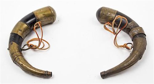 * A Matched Pair of Brass Mounted Powder Horns Length of each 13 1/4 inches.