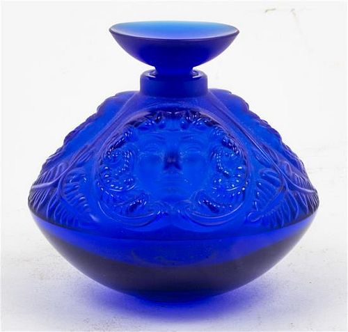 * A Lalique Molded and Frosted Glass Psyche Perfume Bottle Height 3 1/2 inches.