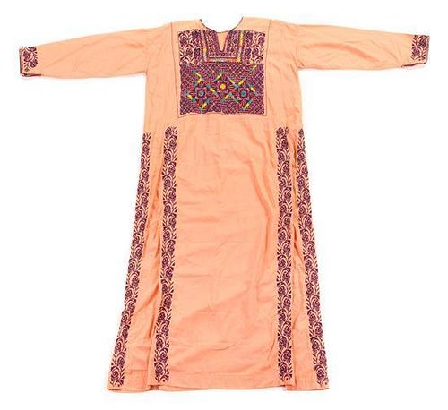 * A Palestinian Embroidered Dress Length of first 53 3/4 inches.