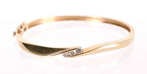A 14k Gold and Diamond Bangle Bracelet