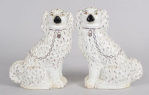 A pair of Staffordshire Earthenware Seated Spaniels