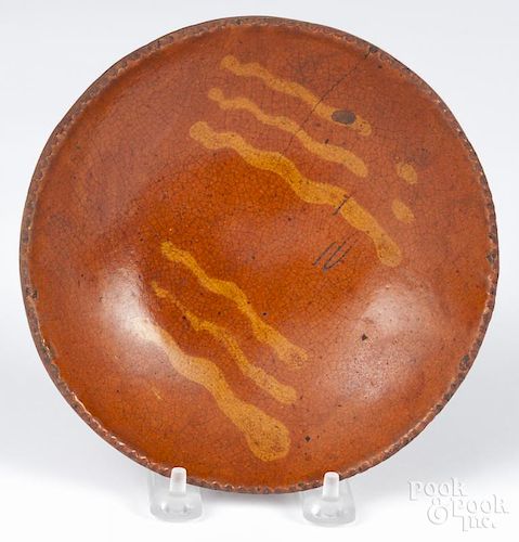 Pennsylvania redware plate, 19th c., with slip decoration, 7'' dia.