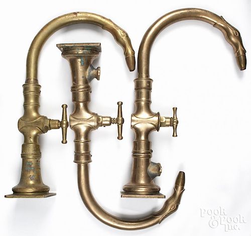 Three large brass swan head faucets, 22 1/4'' h.