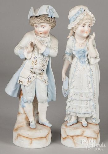 Pair of bisque figures of a boy and girl in blue, 15'' h.