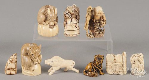 Nine Japanese composition and carved bone netsukes.