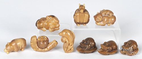 Nine Japanese carved animal netsukes.