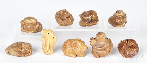 Nine Japanese carved animal netsukes.