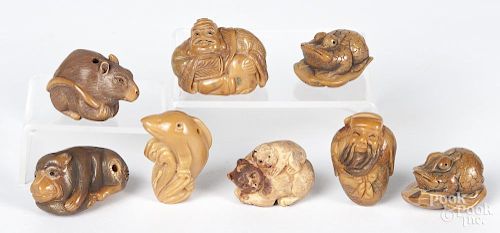 Eight Japanese carved animal netsukes.