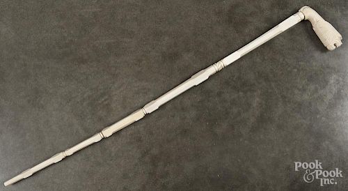 Carved ivory walking stick with a lion's head grip, 37'' l.