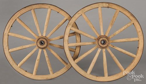 Pair of wood and iron wagon wheels, early 20th c., 24 1/2'' dia.