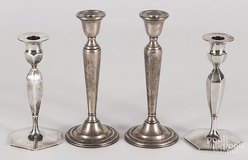 Two pairs of weighted sterling silver candlesticks, 7 1/2'' h. and 9'' h.