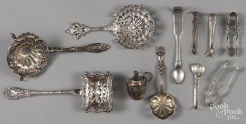 Silver tea items, to include a Webster teapot-form infuser and four strainer spoons
