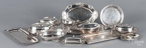 Large group of silver plated trays and serving dishes.