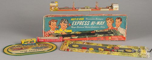 Three tin litho automobile toys, to include a Unique Art wind-up Lincoln tunnel