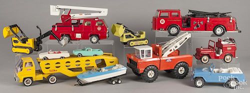 Seven pressed steel Tonka trucks, to include a Mighty Wrecker, a loader, a car carrier