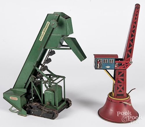 Doepke pressed steel sand loader, 18'' h., together with a Wolverine tin litho derrick crane, 17'' h.