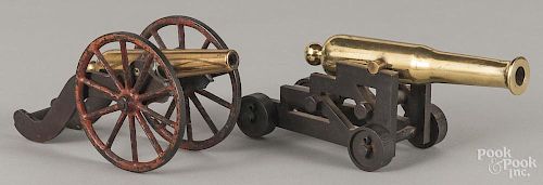 Two brass and iron cannons, one with an embossed star on the barrel, 7'' l., the other - 8 3/4'' l.
