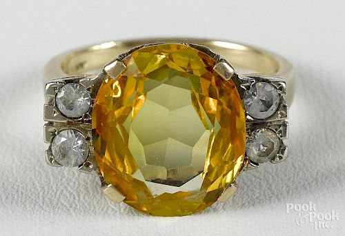 10K yellow gold ring with a large oval citrine flanked by four imitation diamonds, size 7.5, 4.3 dwt