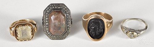 Four rings, to include a silver, marcasite, and jasper ring; a filigree small white gold ring
