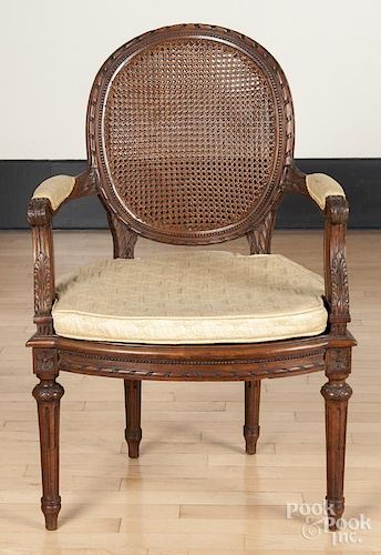 Louis XVI style carved beechwood cane seat fauteuil, ca. 1900.