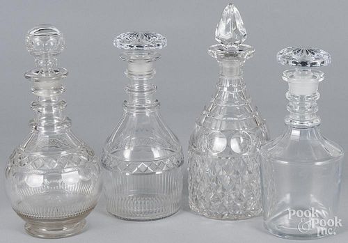 Four colorless glass decanters, tallest - 11 1/2''.
