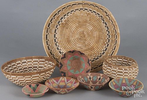 Eight woven baskets, 20th c., to include several Southwest examples, largest - 4 3/4'' h., 20'' w.