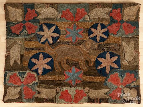 American hooked rug, mid 19th c., of a dog, birds, and flowers, 35'' x 46''.