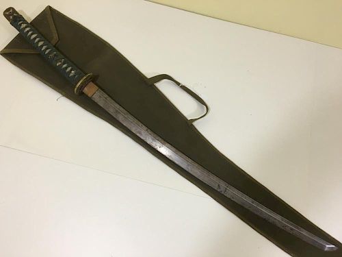 ANTIQUE Japanese WWII Samuri Sword, 1945 with certificate and signed. 41" long with a cloth case 古董日本二战剑，1945证书和签名，41英
