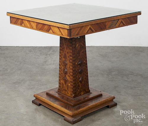 Elaborate parquetry table, early 20th c., with geometric, heart, braid, vine, and starburst patterns