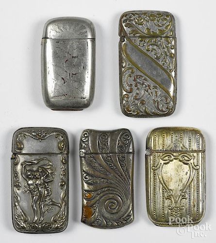 Five nickel silver and silver-plated match vesta safes, to include one with heavy embossed figures