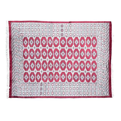 TAPETE IRÁN, SIGLO XX Estilo BOKHARA Con decoraciones geométricas en tono rojo Elaborado en fibras de lana y algodón. 318 x 242 cm