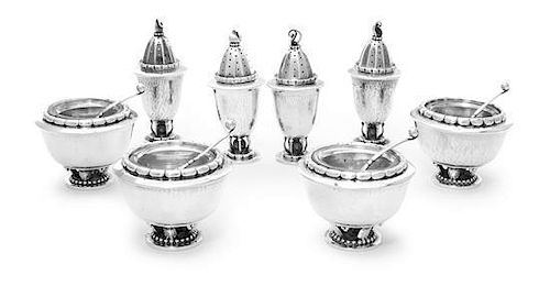 A Set of Four Danish Silver Casters and Four Matching Salts, No 236, Georg Jensen Silversmithy, Copenhagen, 1925-29, designed by