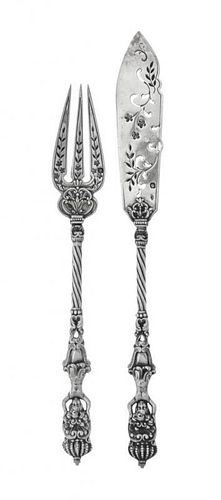 * A French Silver Fish Service, Maker's Mark EE a torch between, Late 19th Century, comprising 12 fish knives and 12 fish forks,