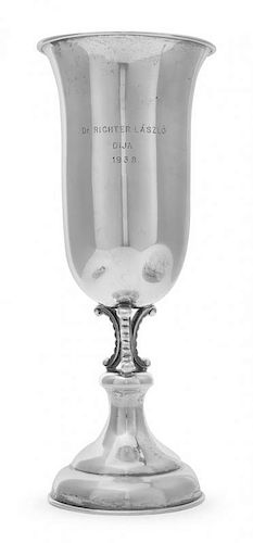 * An Austrian Silver Presentation Cup, Circa 1938, on a stepped domed base rising to a stem formed of lobed scrolls supporting t