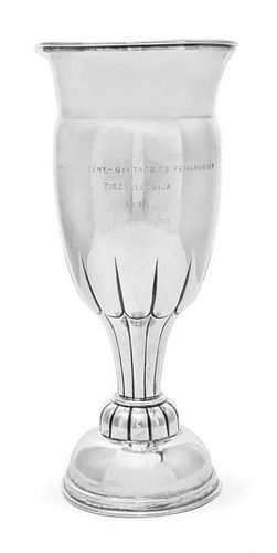 * An Austrian Silver Presentation Cup, Vienna, Circa 1920, on a partly gadrooned stepped domed base rising to a lobed stem, the