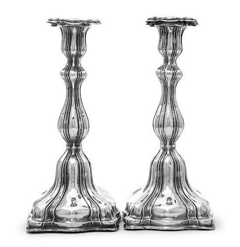 A Pair of Austrian Silver Candlesticks, Maker's Mark AB, Prague, 1861, the shaped square bases chased with lobes rising to confo