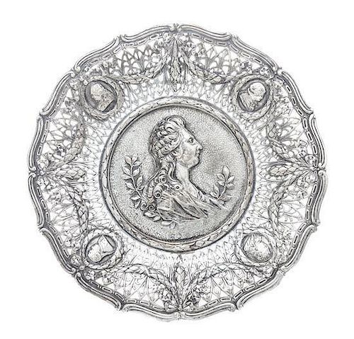 A German Silver Tray, Hanau, Late 19th Century, shaped circular, the center chased in high relief with a profile of Louis XVI, t