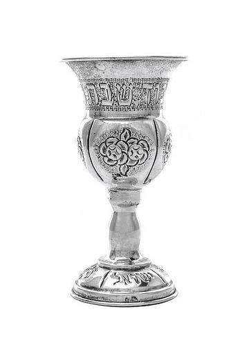 An Israeli Silver Kiddush Cup, 20th Century, the domed bases chased with clusters of flowers and rising to a baluster stem, the