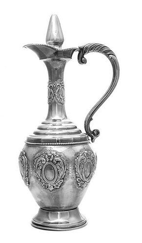 An Israeli Silver Ewer, Masoret, 20th Century, of baluster form chased with foliate cartouches against a matted ground, with ste