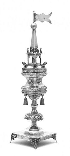 A Russian Silver Large Spice Tower, Circa 1910, the square base raised on elongated cartouche form feet flanked by leafy sprays,