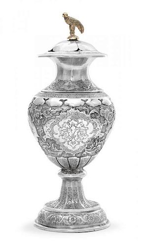 A North African Silver Spice Container, Early 20th Century, of urn form, chased overall with arabesques, flowers and foliage aga