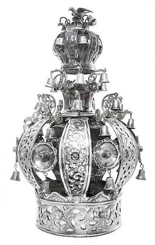 A Continental Silver Torah Crown, Eastern European, Early 20th Century, the base band embossed and pierced with scrolling tooled